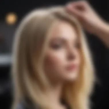 A stylist applying a blonde dye to a client's hair