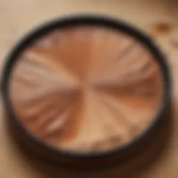 Luxurious dewy cream bronzer texture on a palette