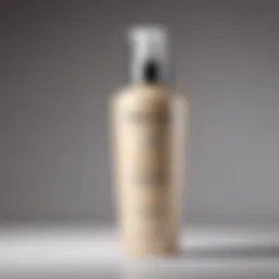 A close-up view of Kerastase leave-in conditioner bottle showcasing its luxurious design.