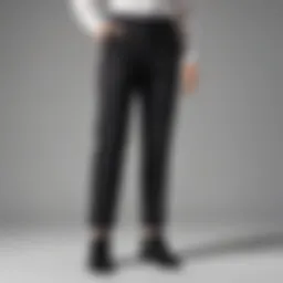 Black work pants styled with minimalist accessories for a sleek look