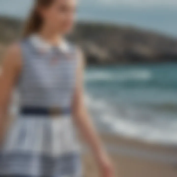 Preppy dress in nautical stripes on teenage girl by the seaside