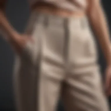 Close-up of fabric texture on tall high waisted wide leg pants emphasizing quality