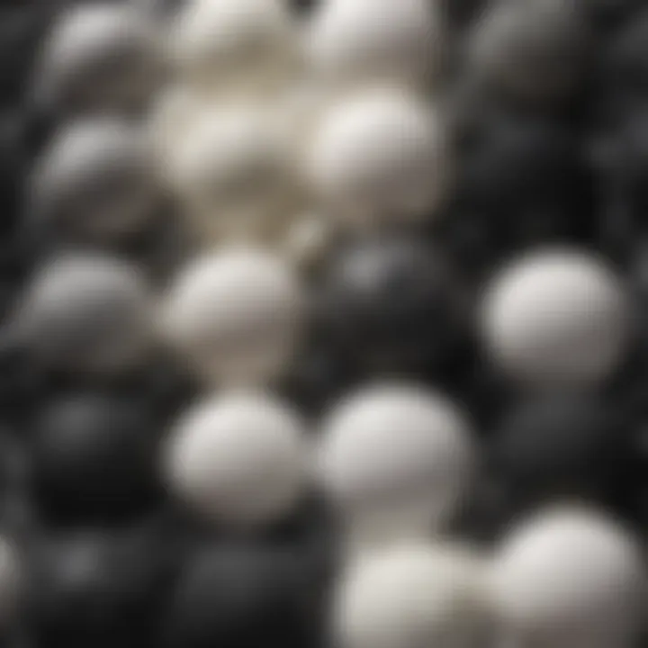 Close-up view of the textures of various black and white creams on a smooth surface